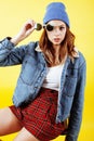 Young pretty teenage woman emotional posing on yellow background, fashion lifestyle people concept Royalty Free Stock Photo