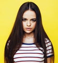 Young pretty teenage woman emotional posing on yellow background, fashion lifestyle people concept Royalty Free Stock Photo