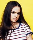 Young pretty teenage woman emotional posing on yellow background, fashion lifestyle people concept Royalty Free Stock Photo