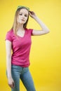 Young pretty teenage woman emotional posing on yellow background, fashion lifestyle people concept Royalty Free Stock Photo