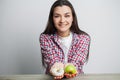 Young pretty woman adheres to diet and chooses healthy food