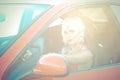 Young pretty woman as driver of red sport car Royalty Free Stock Photo