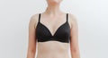 A young pretty woman in a black bra. Stunning girl in underwear. Breast health, body positive, body care, healthy lifestyle. Royalty Free Stock Photo