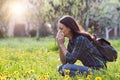 Woman blowing nose because of spring pollen allergy Royalty Free Stock Photo