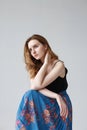 young pretty woman in blue skirt, indoors portrait of cute thoughtful model Royalty Free Stock Photo