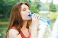 Young pretty, woman drinking water Royalty Free Stock Photo
