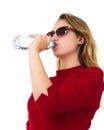 Young pretty woman drinks water Bottle or glass of spring water Royalty Free Stock Photo