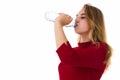 Young pretty woman drinks water Bottle or glass of spring water Royalty Free Stock Photo