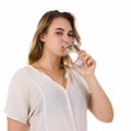 Young pretty woman drinks water Bottle or glass of spring water Royalty Free Stock Photo