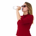 Young pretty woman drinks water Bottle or glass of spring water Royalty Free Stock Photo