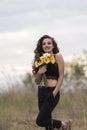 Young pretty woman holding a bouquet of flowers Royalty Free Stock Photo