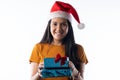 Young pretty woman holding boxes of presents. White background