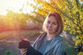 Young pretty woman holding her pet cat. Sunset on the background Royalty Free Stock Photo