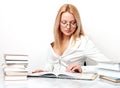 Young pretty woman learning at table with books