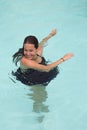 Young pretty woman portrait wearing black dress in swimming pool Royalty Free Stock Photo