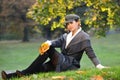 Young woman relaxing in the autumn park. Royalty Free Stock Photo