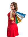Young pretty woman is shopping with colorful bags. Isolated on white. Royalty Free Stock Photo