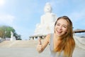 Young pretty woman show thumbs up or like, background of Big Buddha Phuket Royalty Free Stock Photo