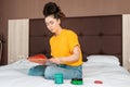 A young pretty woman sitting on the bed and reading a magazine. Home. Reading and education Royalty Free Stock Photo