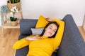 Young pretty woman sleeping on sofa at home Royalty Free Stock Photo