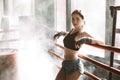 Young pretty woman standing on ring and resting. Close-up portrait of female fit girl at a boxing studio with bright Royalty Free Stock Photo