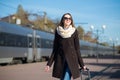 Young pretty woman with a suitcase Royalty Free Stock Photo