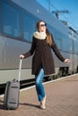 Young pretty woman with a suitcase Royalty Free Stock Photo