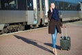 Young pretty woman with a suitcase Royalty Free Stock Photo