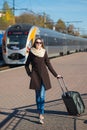Young pretty woman with a suitcase Royalty Free Stock Photo