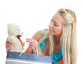 Young pretty woman taking out teddy bear from shop bag. Royalty Free Stock Photo