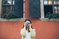 Young pretty woman taking picture with old camera Royalty Free Stock Photo