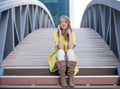 Young pretty woman talking at cellular phone on Bridge - woman having a conversation at smartphone. Royalty Free Stock Photo