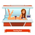 Young pretty woman in tanning bed. Artificial tan Royalty Free Stock Photo