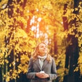 Young pretty woman walking in the autumn park Royalty Free Stock Photo