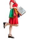 Young pretty woman is walking and shopping with colorful bags. Royalty Free Stock Photo