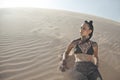 Young pretty woman in white sand dunes like a Royalty Free Stock Photo