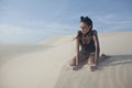 Young pretty woman in white sand dunes like a Royalty Free Stock Photo