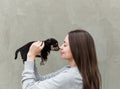 The young pretty women with a little cute puppy