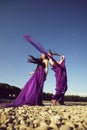 Women in violet dresses