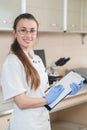 Young prettyl woman scientist holding a folder Royalty Free Stock Photo