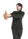 Young priest with bottle of alcohol isolated Royalty Free Stock Photo