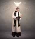 Young priest in giving his blessing