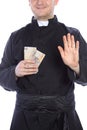 Priest holds money Royalty Free Stock Photo