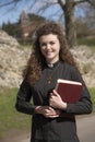 Young priest visiting her parish in the countryside