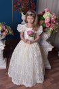 Young princess in a white dress with a tiara on her head Royalty Free Stock Photo