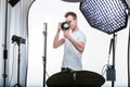 Young pro photographer with digital camera Royalty Free Stock Photo