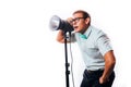 Photographer in his studio setting up lights for the upcoming photoshoot Royalty Free Stock Photo