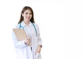 Young professional Asian woman doctor wears medical white lab coat stand and hold clipboard in her hand at work office in Royalty Free Stock Photo