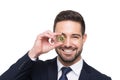 Young professional businessman holding bitcoin in front of eye i