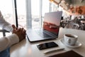 Young professional businessman is resting sitting at his workplace at a table with a laptop on a spring day. Successful blogger Royalty Free Stock Photo